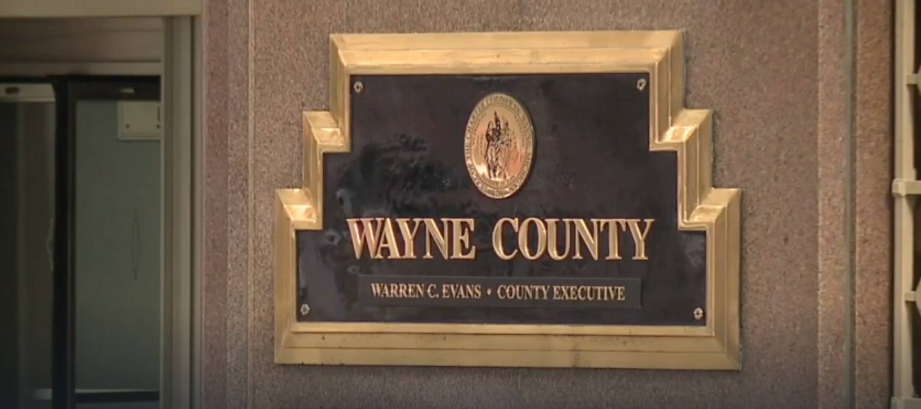 Wayne County plaque on a building.
