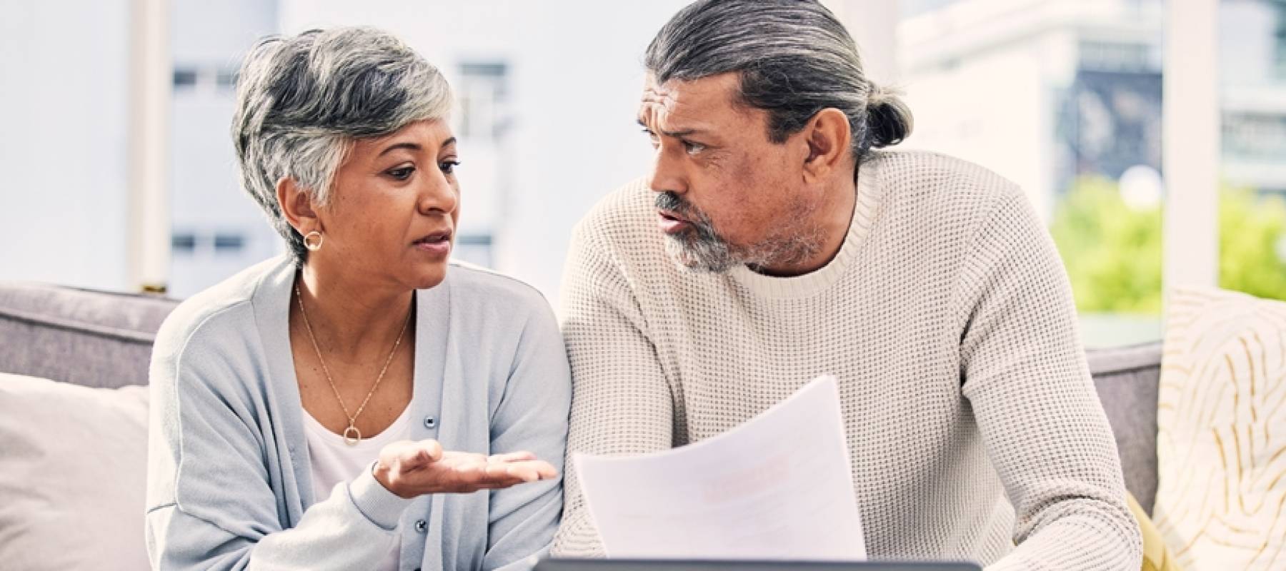 Couple looking at their finances together
