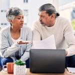 Couple looking at their finances together