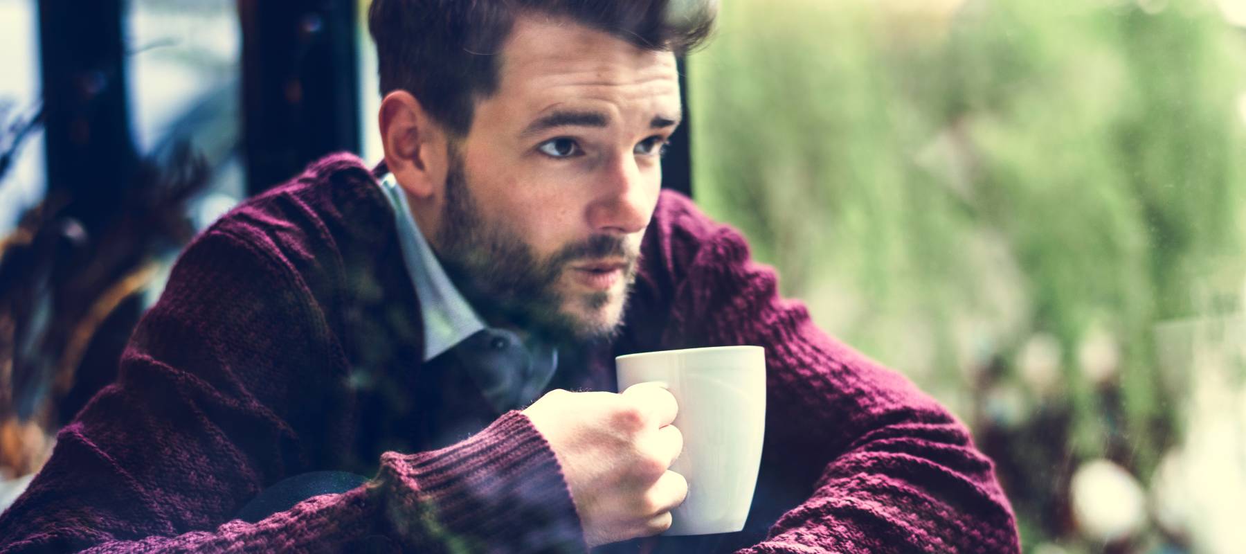 Worried man drinking coffee.