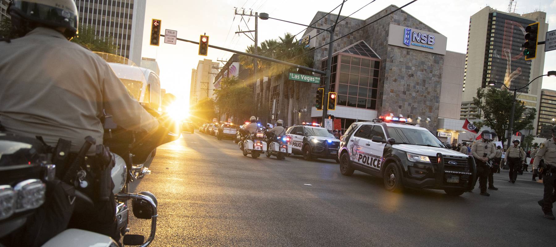 Police monitor a crowd as it dissipates in Las Vegas, June 14, 2025.