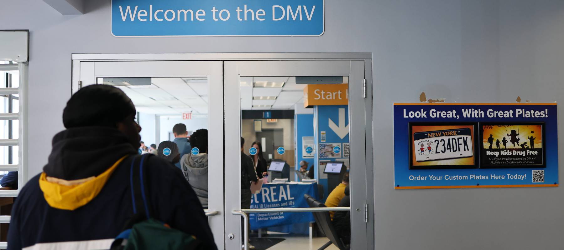 A person prepares to enter a New York State DMV in New York City, April 28, 2025.
