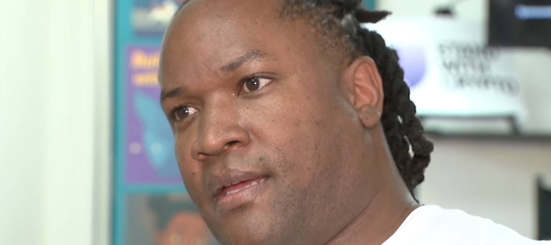 Man speaking on camera.