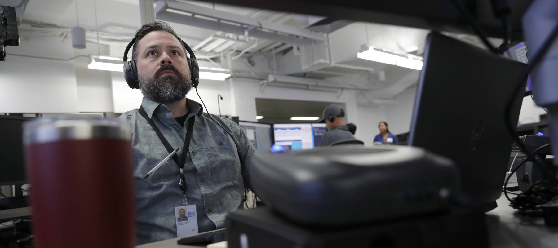 Senior analyst Kristopher Duncan-Sheehy monitors at the PG&E Hazard Awareness Warning Center (HAWC) in San Ramon, California