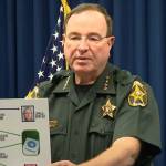 Polk County Sheriff Grady Judd and Attorney General James Utheimer presenting the fraud ring.