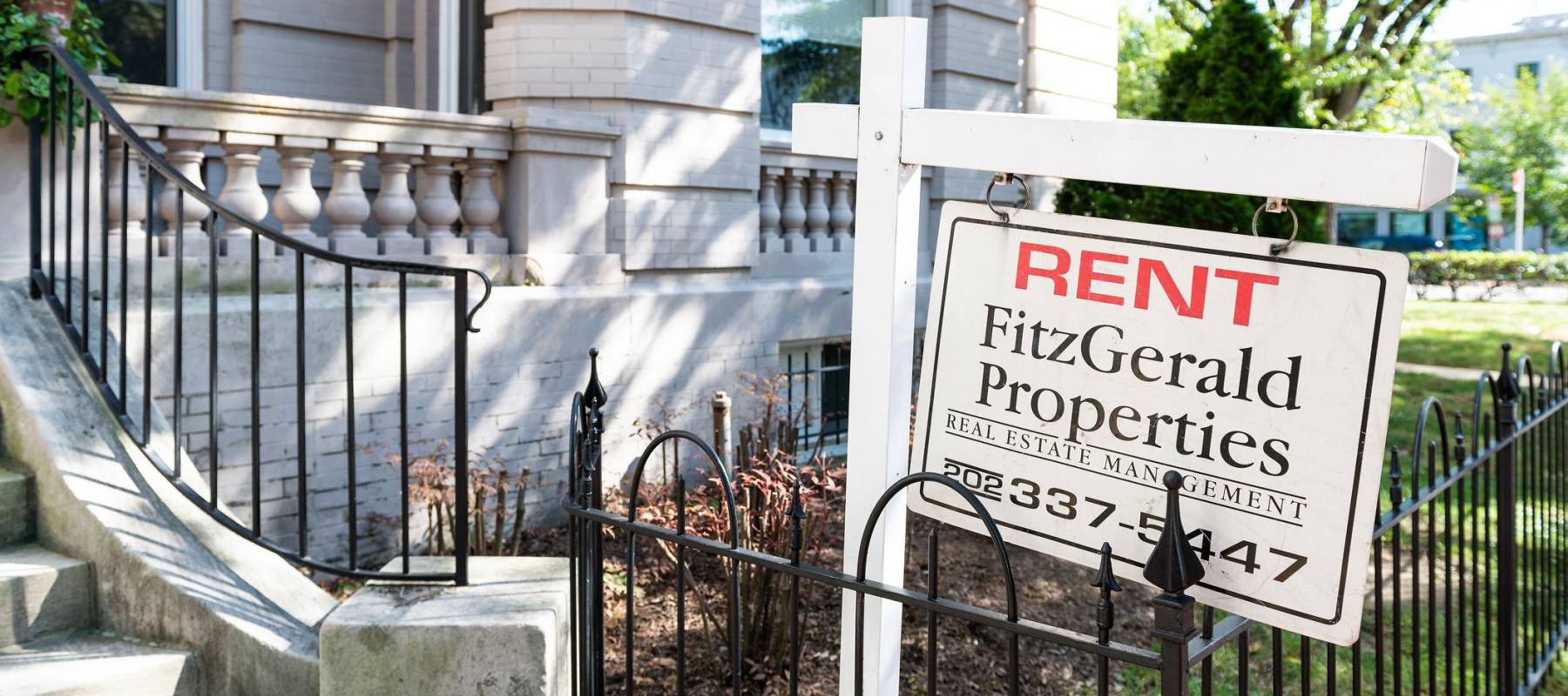 For rent sign outside of a single-family home.