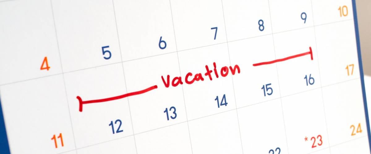 Red vacation write on white calendar marked for remember and target time to long vacation and relax time.