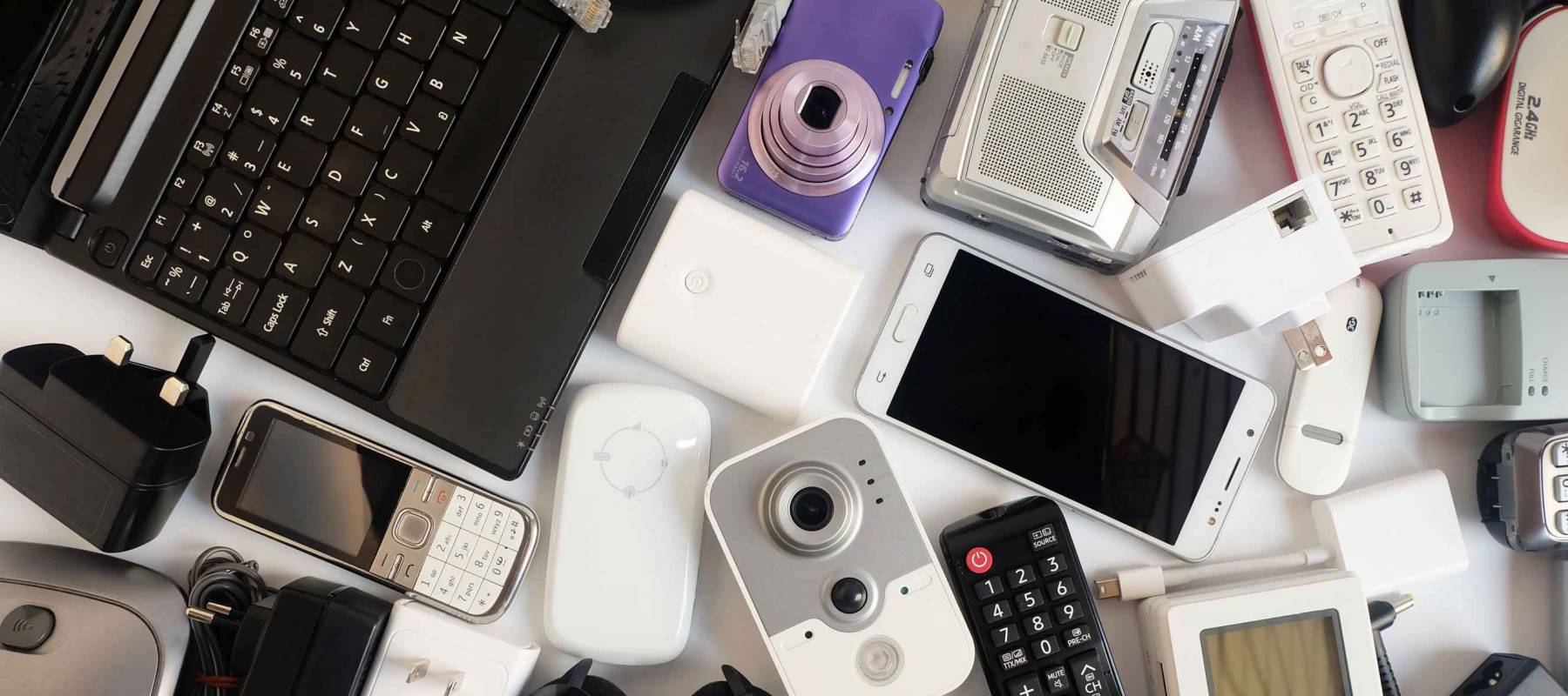 Used modern Electronic gadgets for daily use on White floor, Reuse and Recycle concept, Top view.