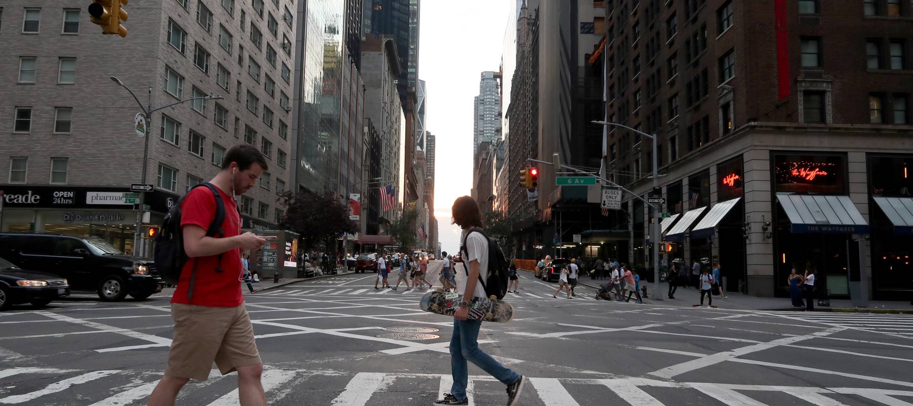 Residents cross 57th Street in New York City on June 13, 2017.