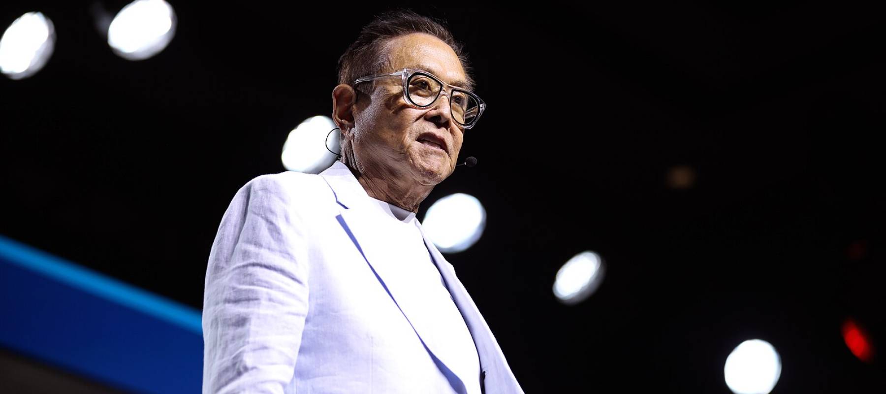 Robert Kiyosaki speaking with attendees at the 2024 FreedomFest at Caesars Forum Conference Center in Las Vegas, Nevada.