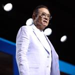 Robert Kiyosaki speaking with attendees at the 2024 FreedomFest at Caesars Forum Conference Center in Las Vegas, Nevada.