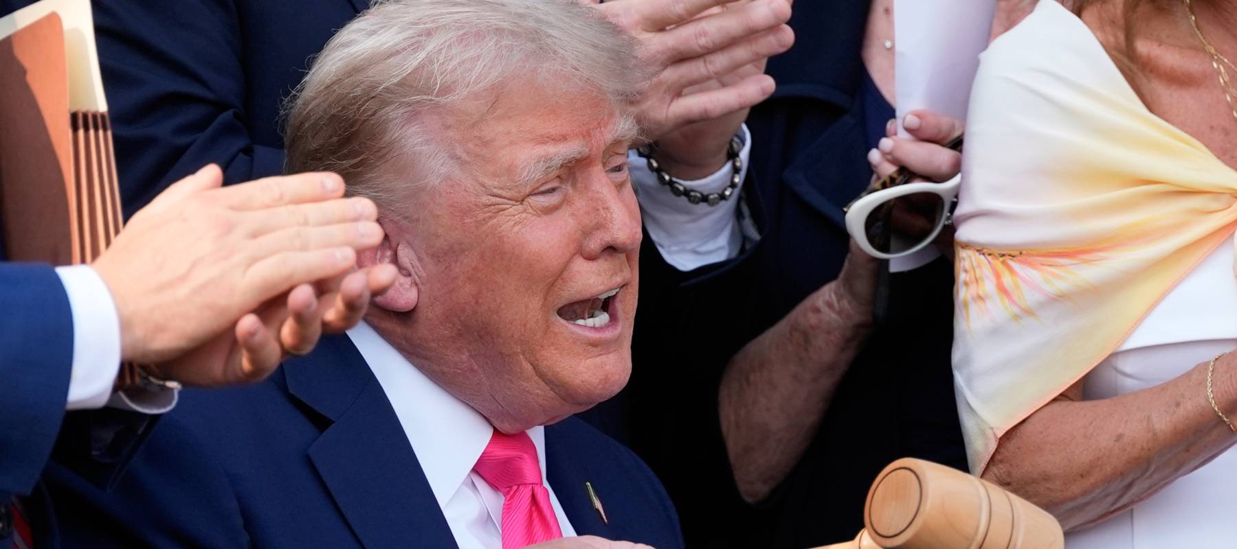 President Donald Trump bangs a gavel after signing the One, Big Beautiful Bill Act into law during at the White House in Washington, D.C., July 4, 2025.