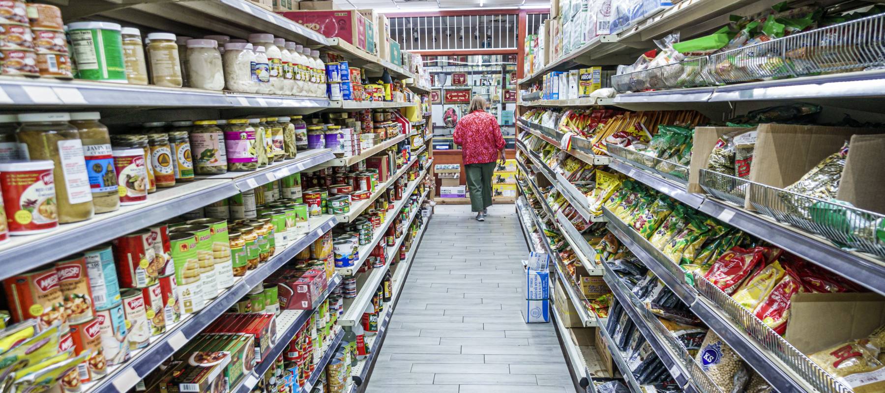Woman shopping in grocery store.