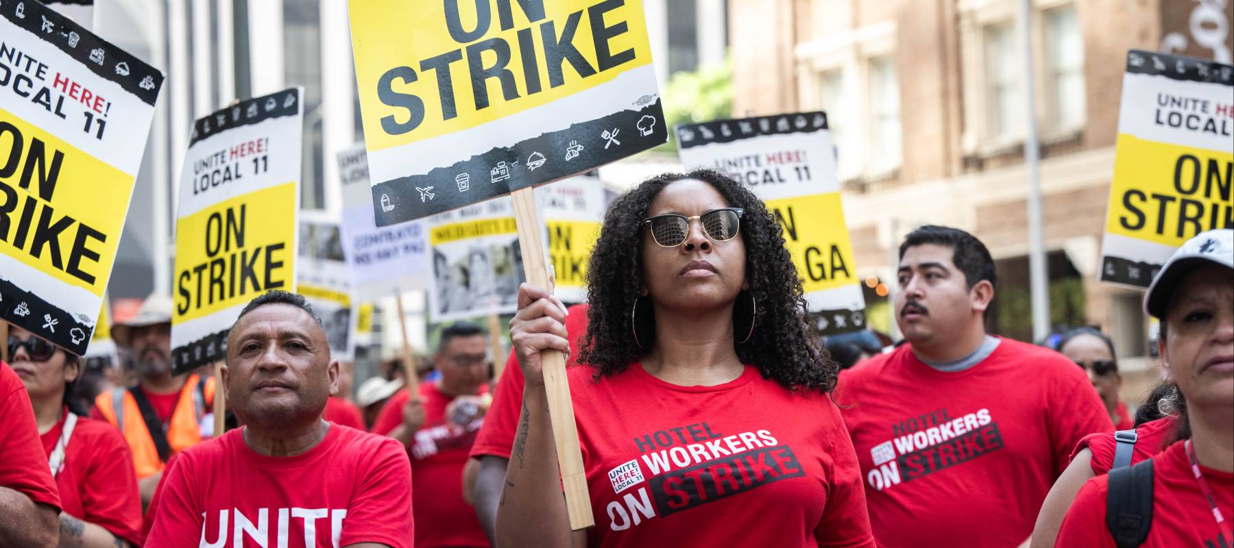 Striking hotel workers and their supporters rally at the InterContinental Los Angeles Downtown hotel.