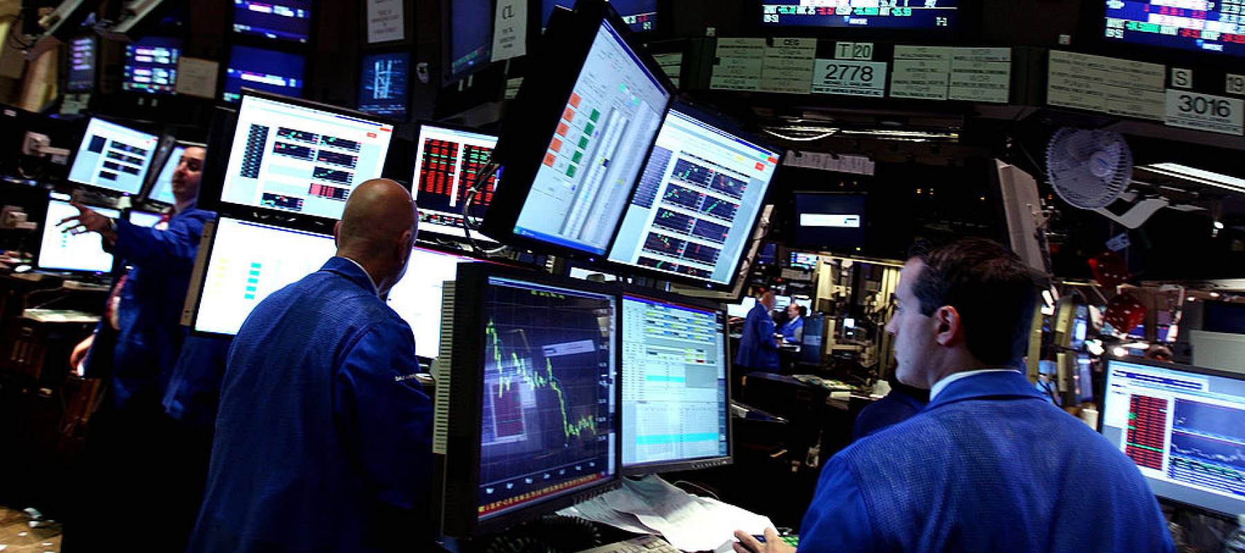 Traders on NYSE trading floor.