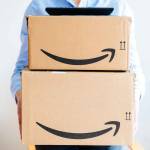 PARIS, FRANCE - JAN 28, 2016: Amazon Prime logotype printed on cardboard box