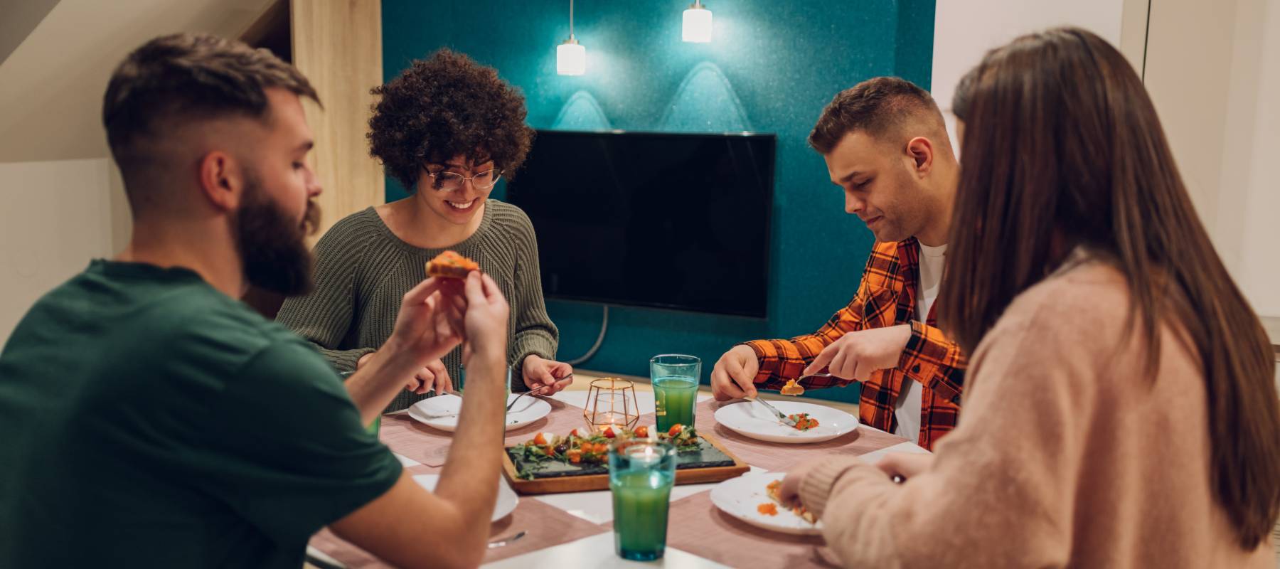 A group of people eating a meal together.