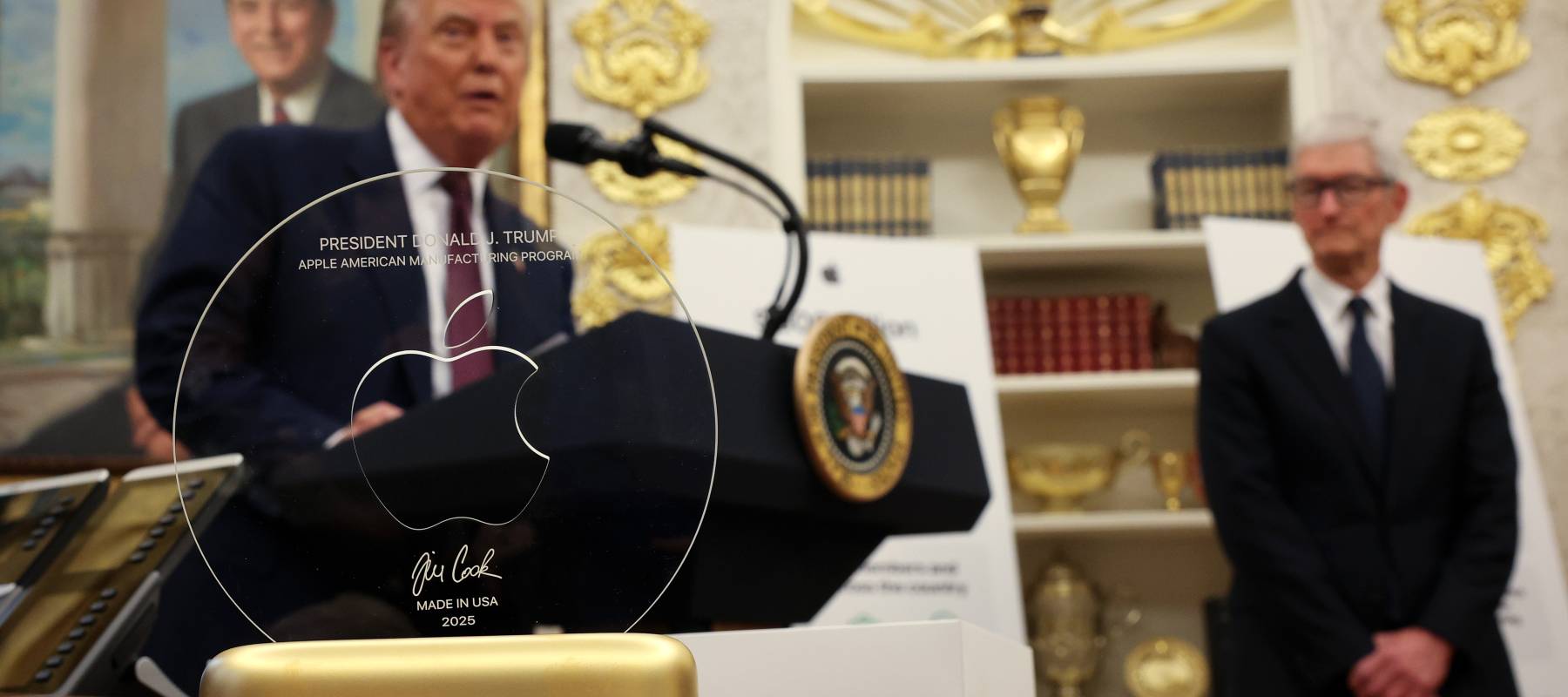 Apple CEO Tim Cook's 24-karat gold gift to President Trump comes as the commodity's value is soaring.