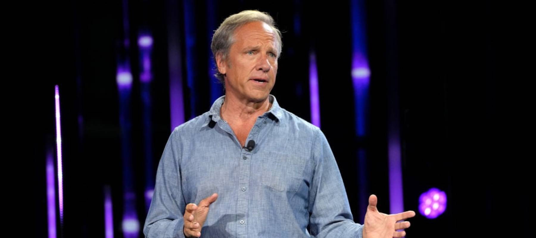 Mike Rowe on stage at a 2022 event