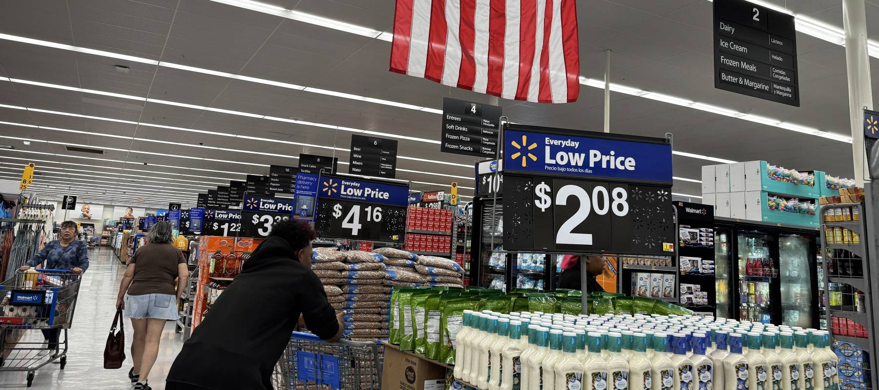 Customers shop at a Walmart store in San Leandro, California, April 9, 2025.