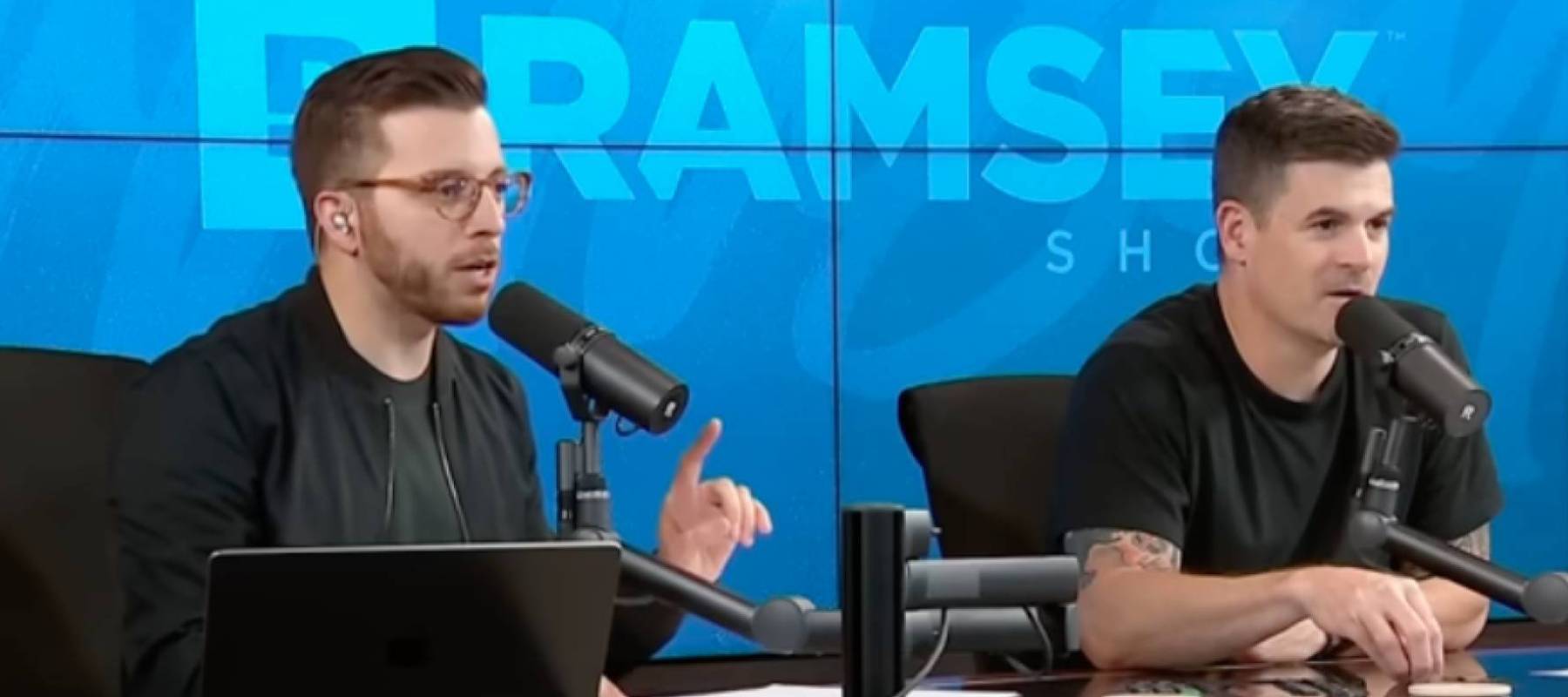 Two Ramsey Show hosts talk to caller.