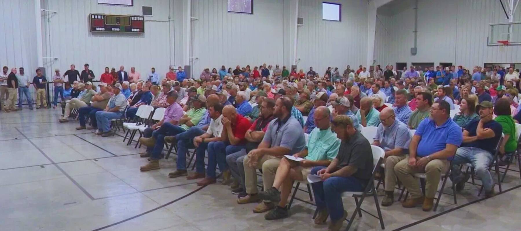 Farmers gather and pray for relief from the government.