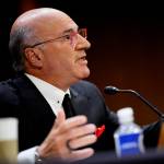 Kevin O'Leary spreads both hands wide as he speaks at a podium and looks at you over red-rimmed glasses.