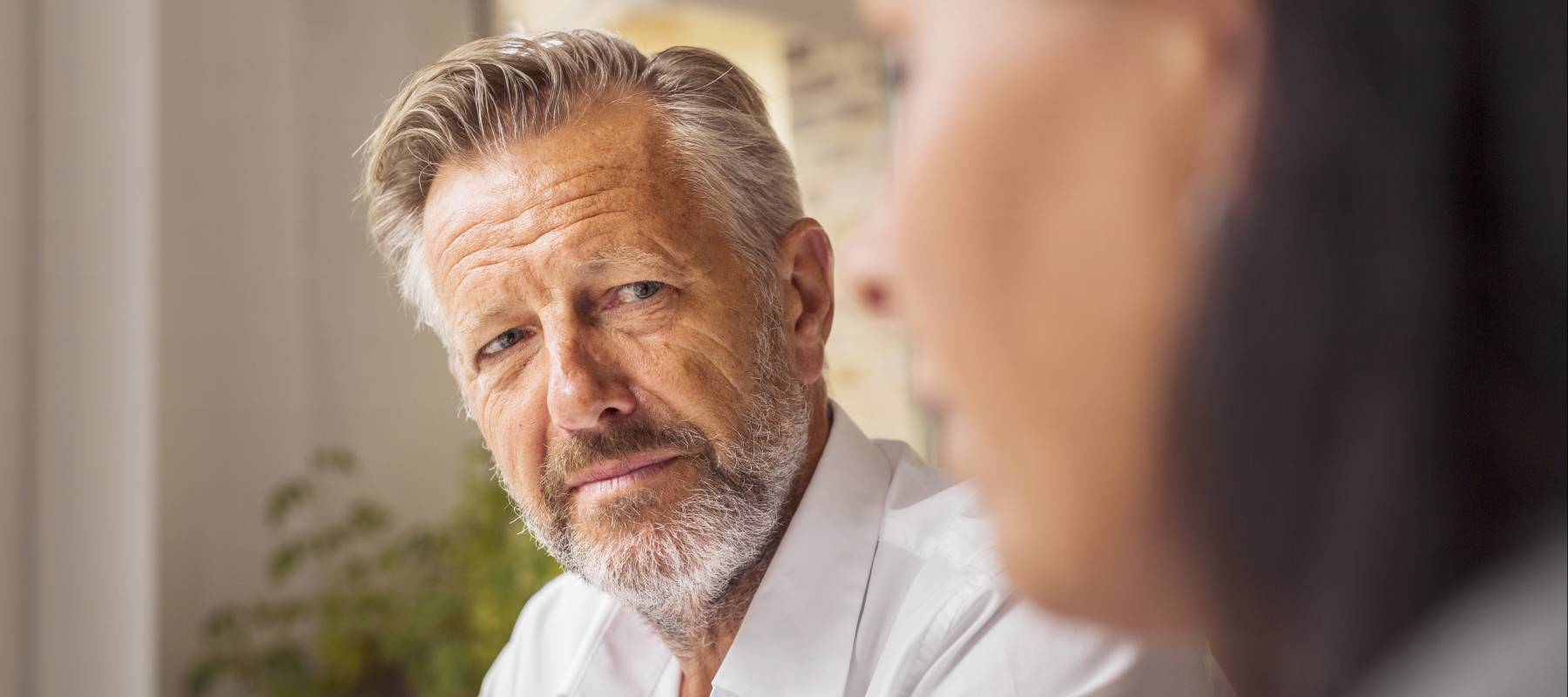 Man and his wife looking serious.