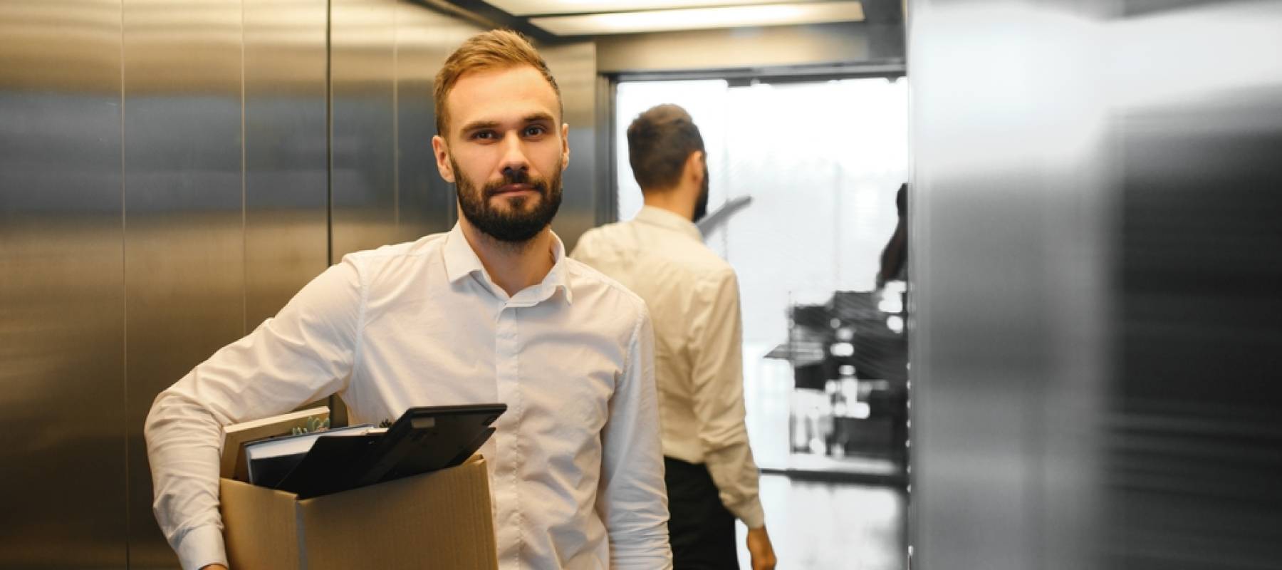 Mature bearded Caucasian man feeling upset after being resigned from successful company.