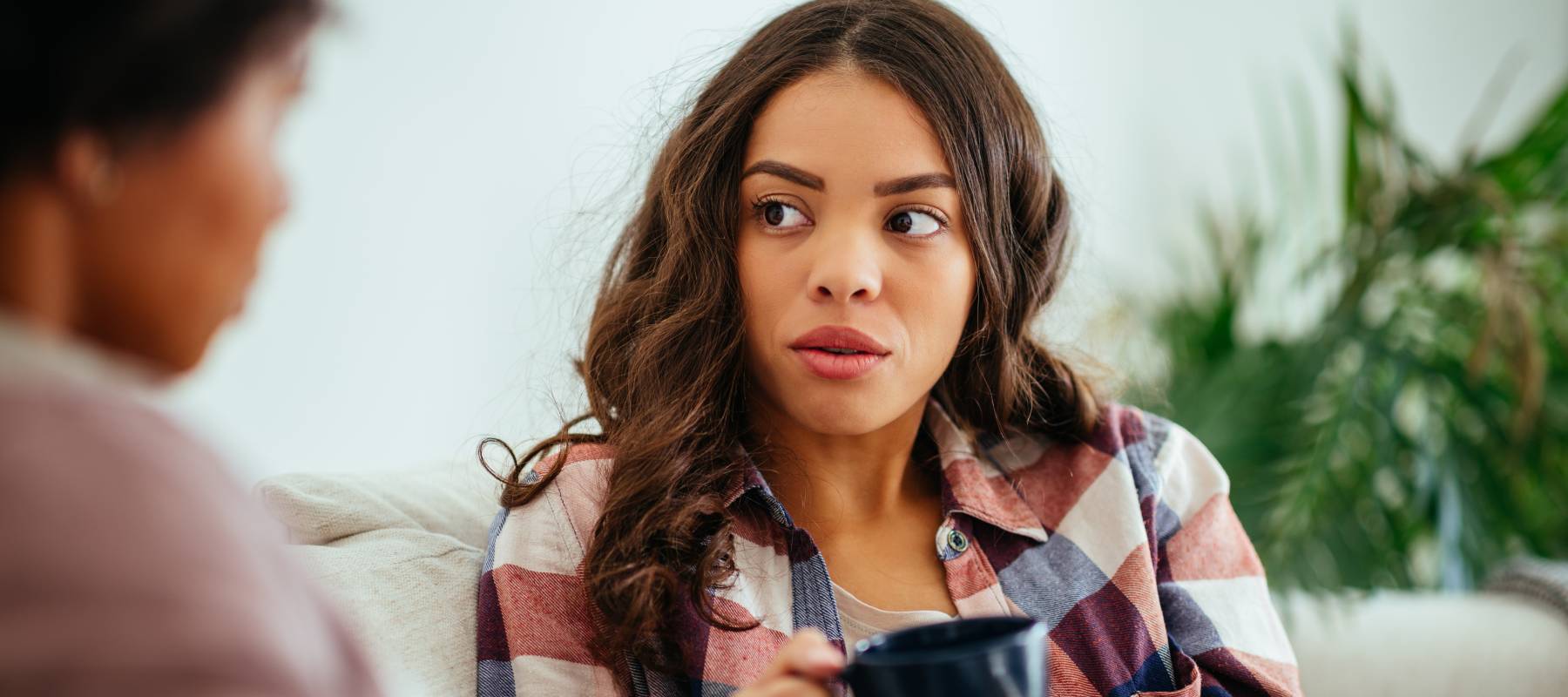 Young woman talking to older woman.