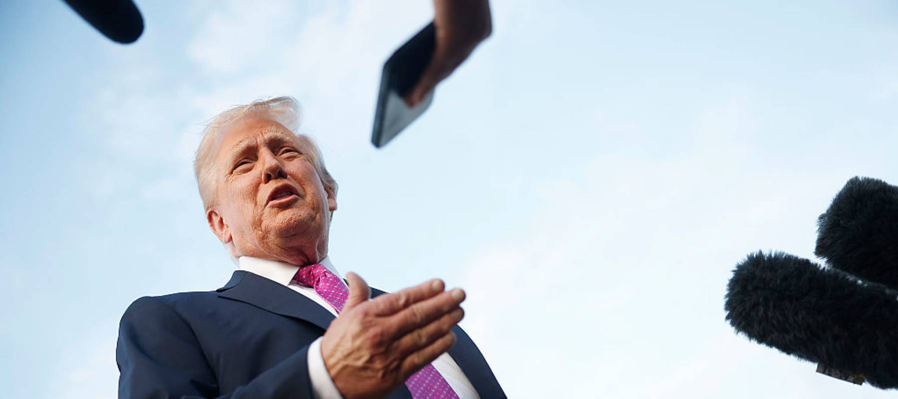 Trump talking to reporters.