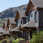 Row of repeating condominiums with a mountain behind in Colorado