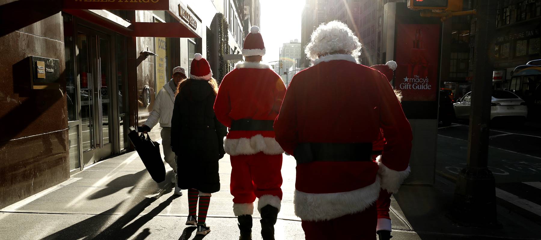 People dressed in Santa Claus costumes participate in the annual SantaCon