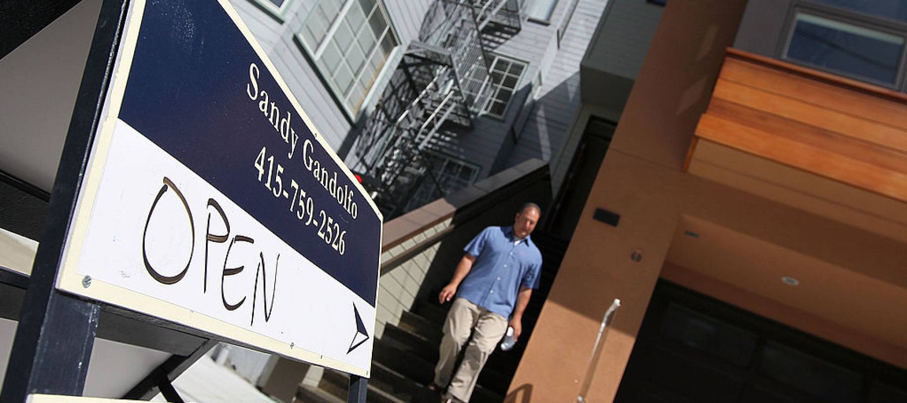 A man leaves an open house.