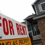 House with 'for rent' sign.