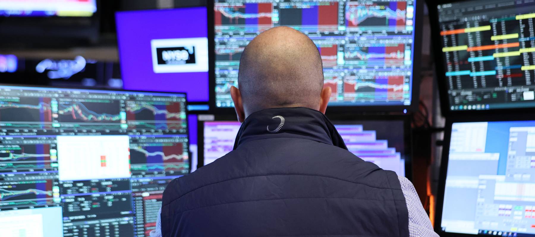Traders work on the floor of the New York Stock Exchange in New York City, Aug. 26, 2025.