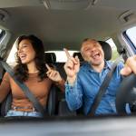 Happy couple driving.