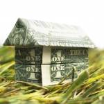 Going green — origami cash house on grass
