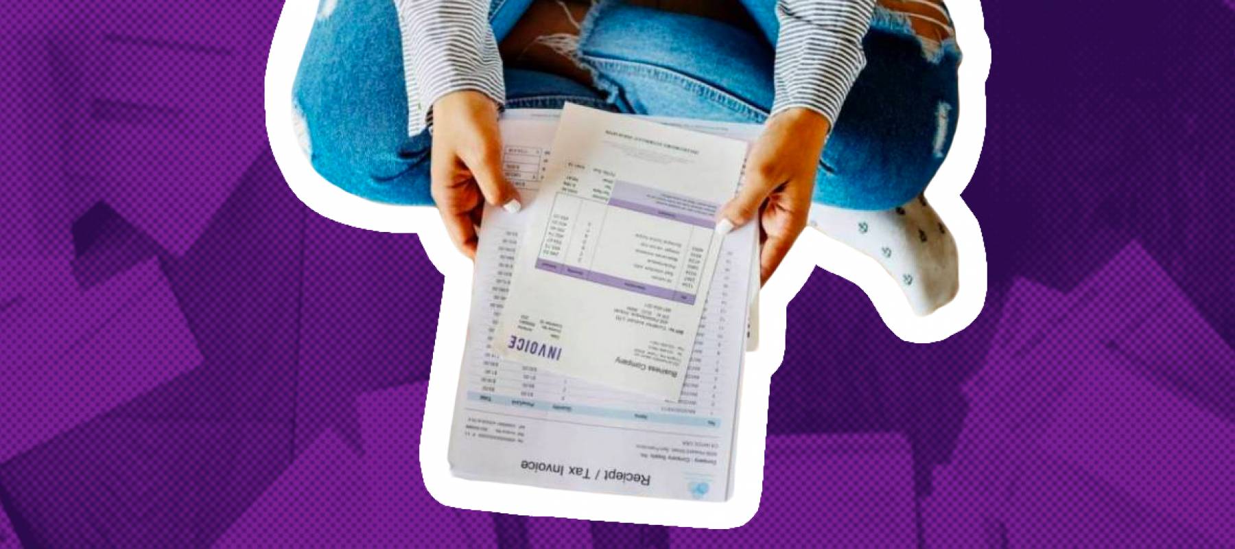 Sitting on the floor looking over multiple bills