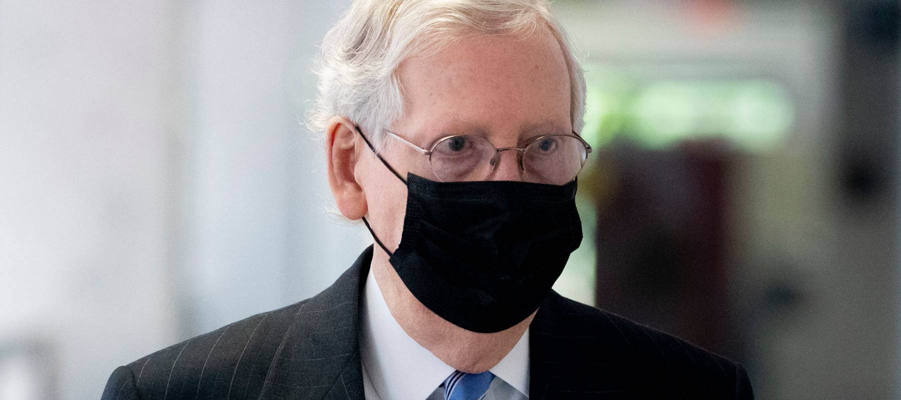 Wearing a black mask, Senate Majority Leader Mitch McConnell leaves a Republican luncheon on Capitol Hill in Washington, DC, on Sept. 16, 2020