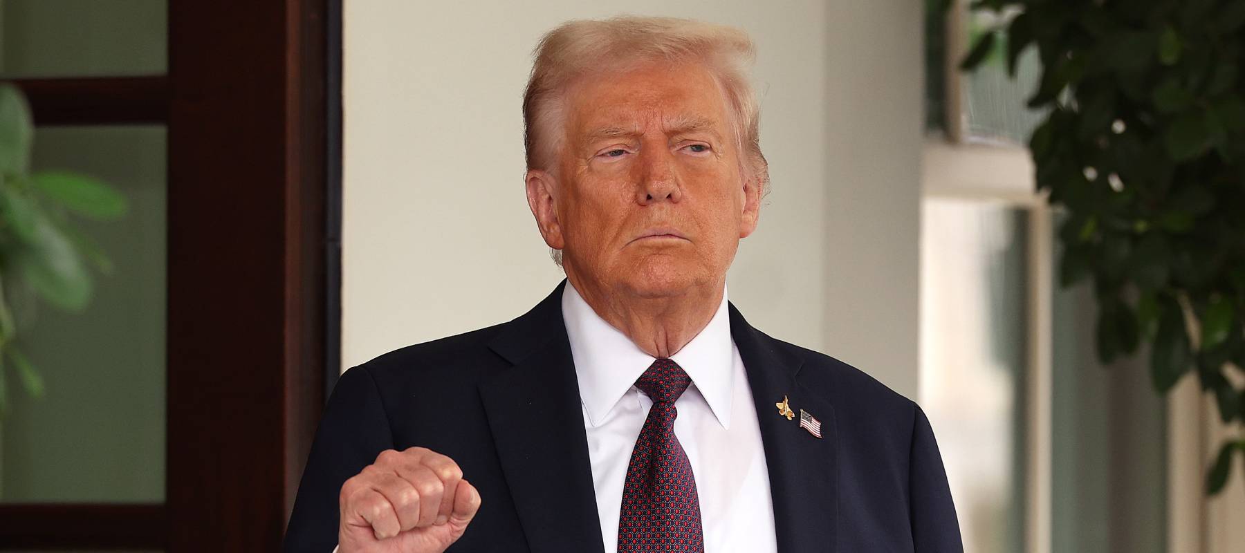 U.S. President Donald Trump pumps his first as he waits to welcome Israeli Prime Minister Benjamin Netanyahu at the White House on September 29, 2025 in Washington, DC.