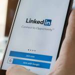 LinkedIn application on the screen. LinkedIn is a business-oriented social networking service.