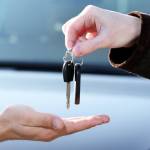 man buying a car keys being handed over