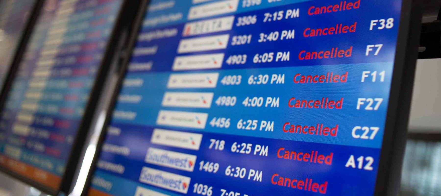 A display board at Philadelphia International Airport shows mostly canceled flights during a Nor'easter that brought heavy snow, Wednesday, March 21, 2018.