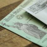 Extreme close-up of Federal coronavirus stimulus check provided to all Americans from the United States Treasury in 2020, showing the statue of liberty.