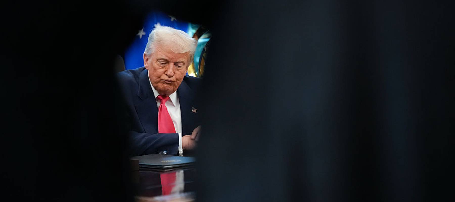 U.S. President Donald Trump answers questions from reporters in the Oval Office on August 14, 2025