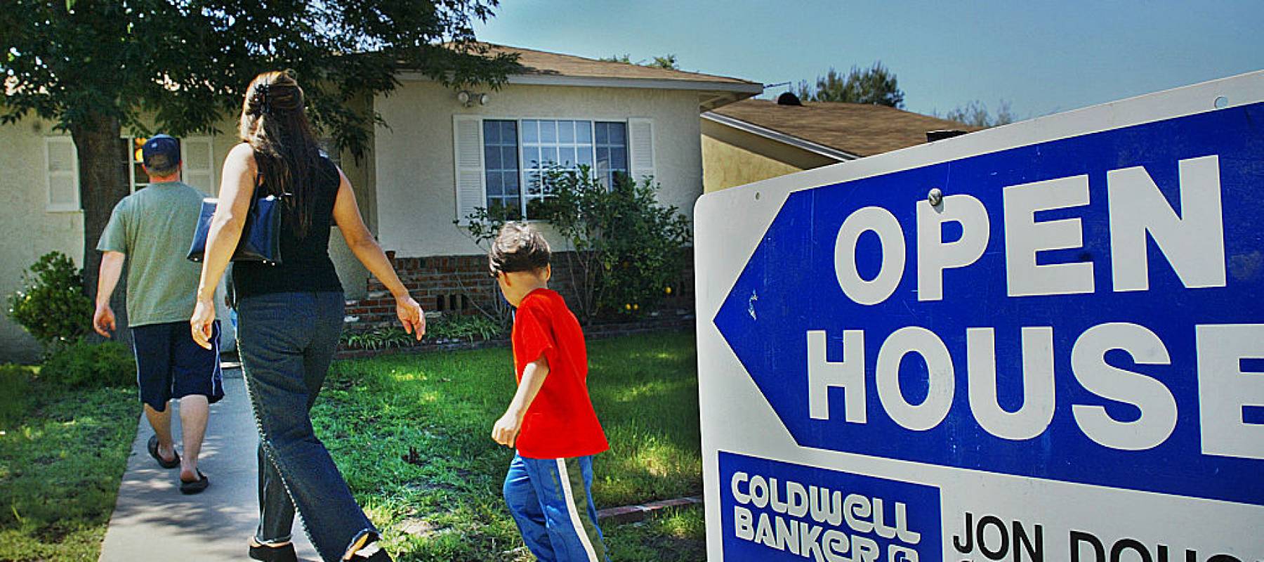 Open house on a home for sale in Sherman Oaks. Pic. shows a house seeker with family going to the open house.