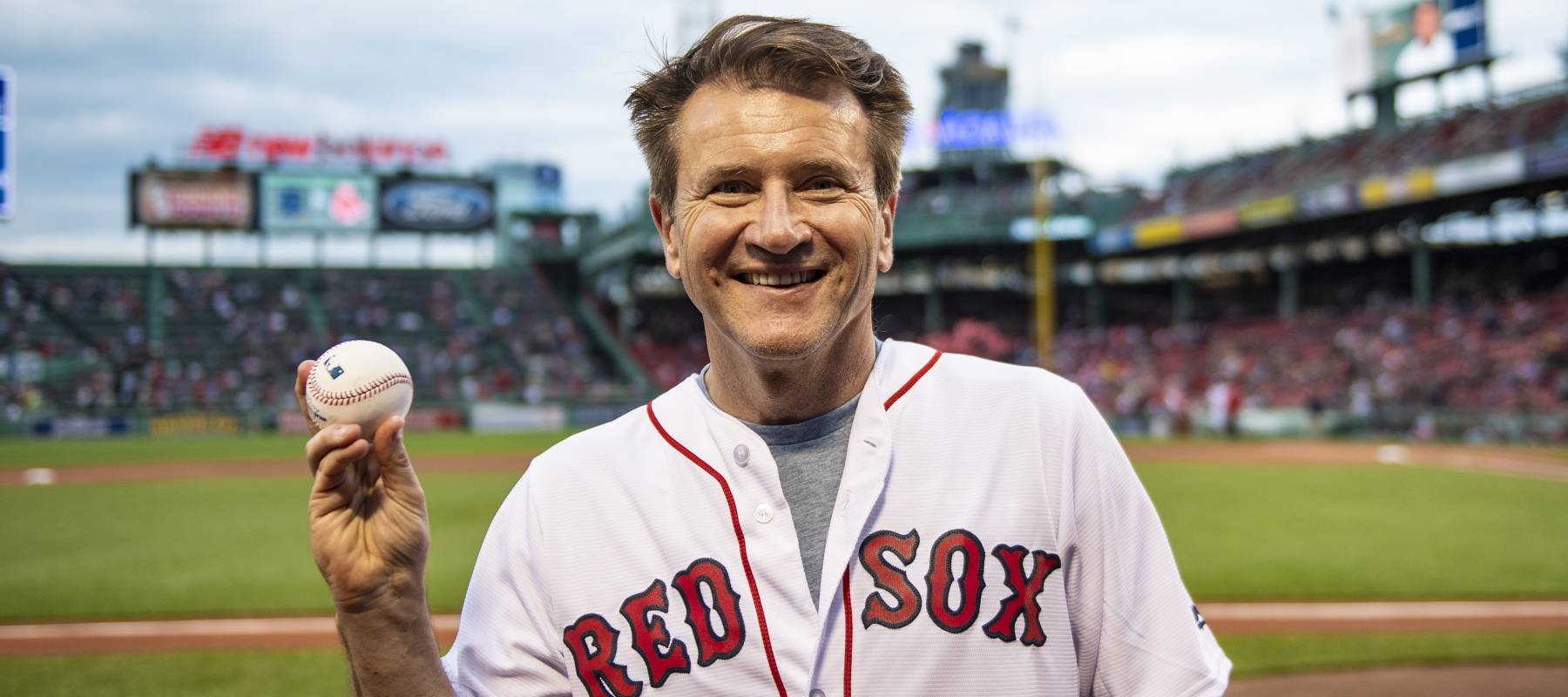 Robert Herjavec of Shark Tank poses for a photograph after throwing out a ceremonial first pitch in 2018.