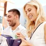 A couple on a date pull out their wallets.
