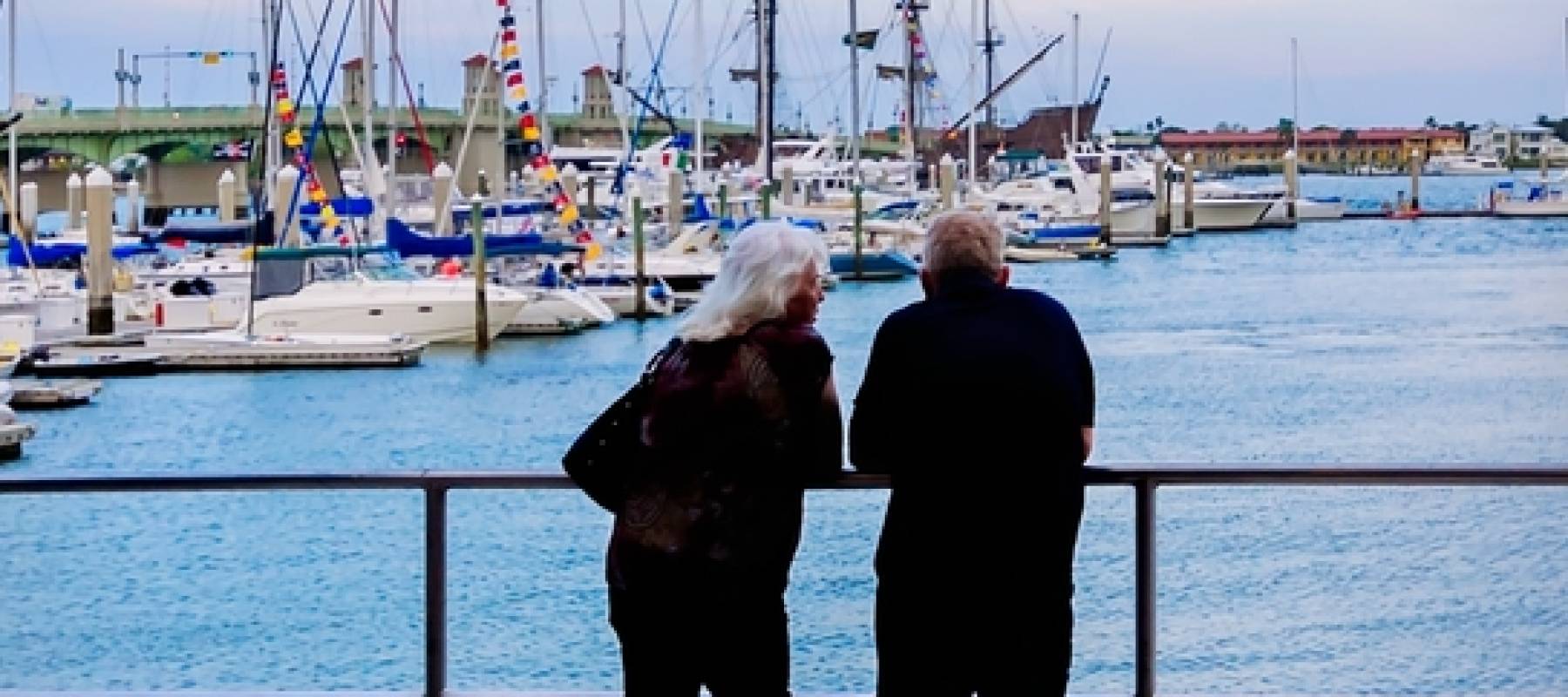 An older couple overlooking a marina in Florida.